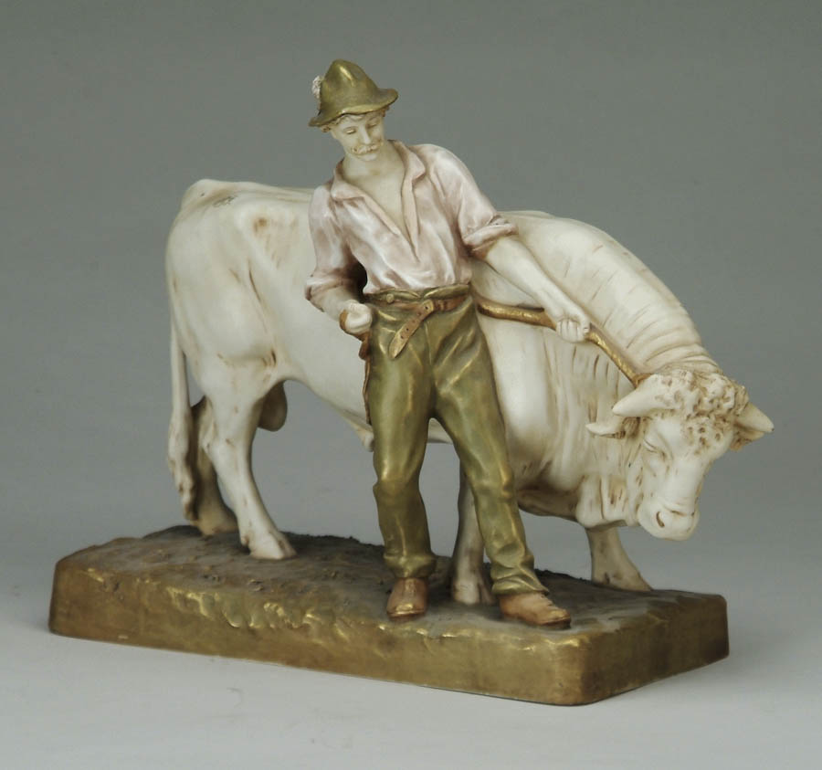 Appraisal: ROYAL DUX FIGURE OF A MAN WITH BULL Pink triangle