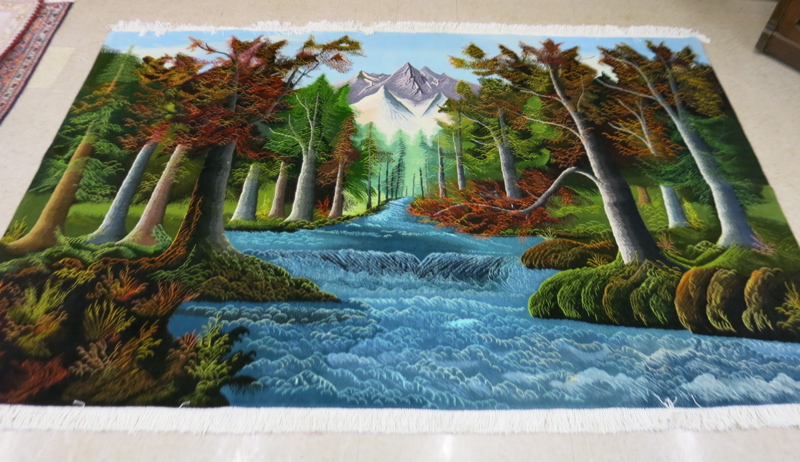 Appraisal: HAND KNOTTED PERSIAN LANDSCAPE CARPET a mountain landscape with fall