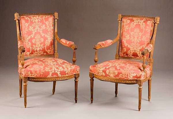 Appraisal: A pair of Louis XVI style beechwood fauteuils circa height