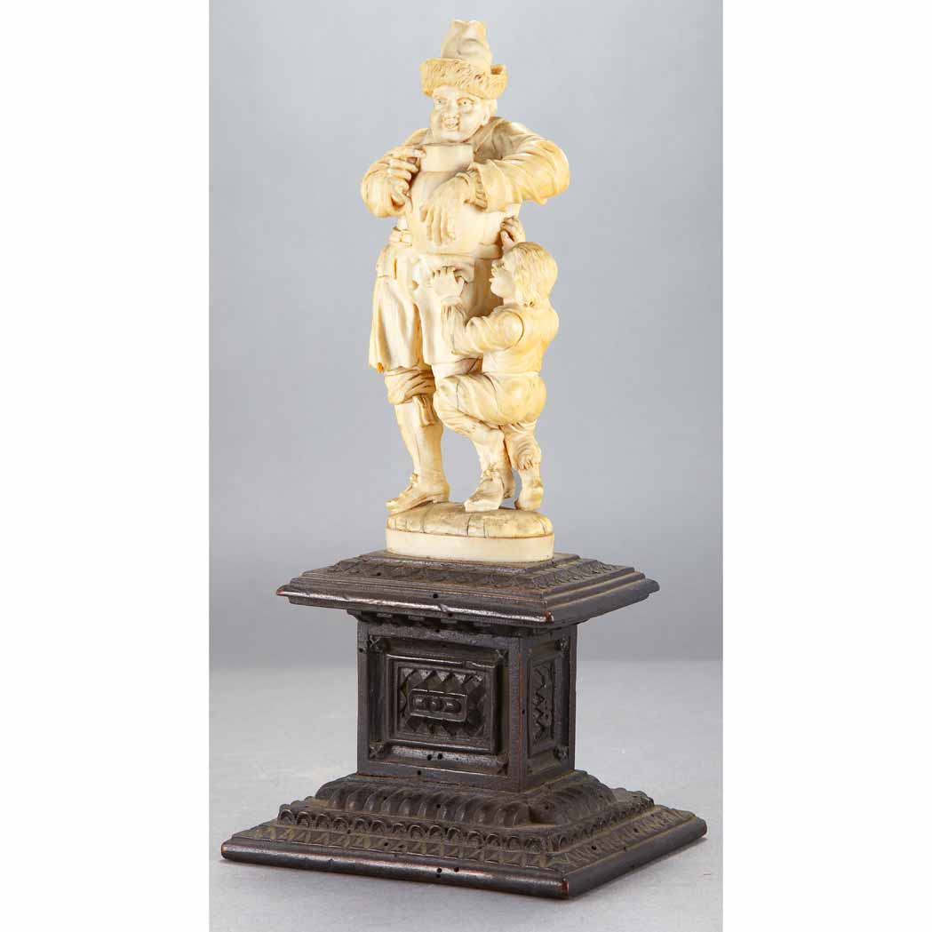 Appraisal: German Ivory Figural Group Late th century Of a man