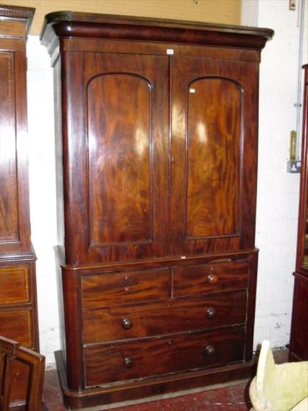 Appraisal: A th century figured mahogany linen press