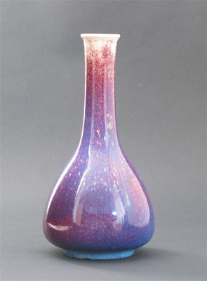 Appraisal: A Ruskin Pottery high-fired stoneware vase carafe shape with everted