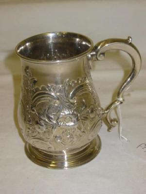 Appraisal: A GEORGE III TANKARD of baluster form with moulded rim