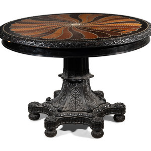 Appraisal: An Anglo-Colonial Carved and Specimen Woods Inlaid Tilt-Top Breakfast Table