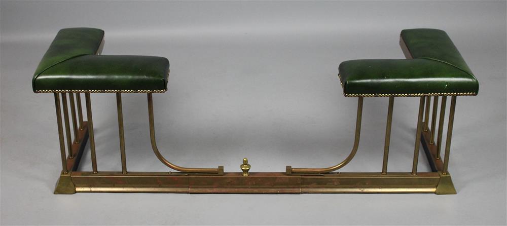 Appraisal: VICTORIAN STYLE BRASS AND GREEN LEATHER FIRE BENCH with twin