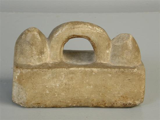 Appraisal: Antique marble weight with arch shaped handle flanked by two