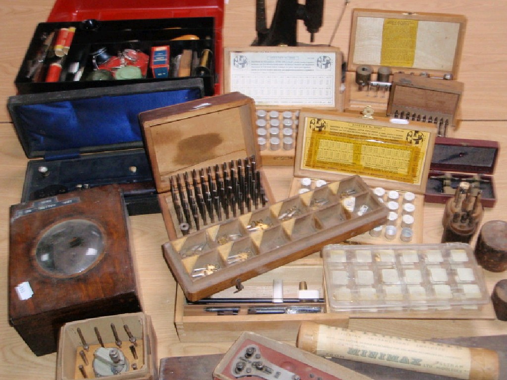 Appraisal: A collection of watch makers tools spares glasses etc including