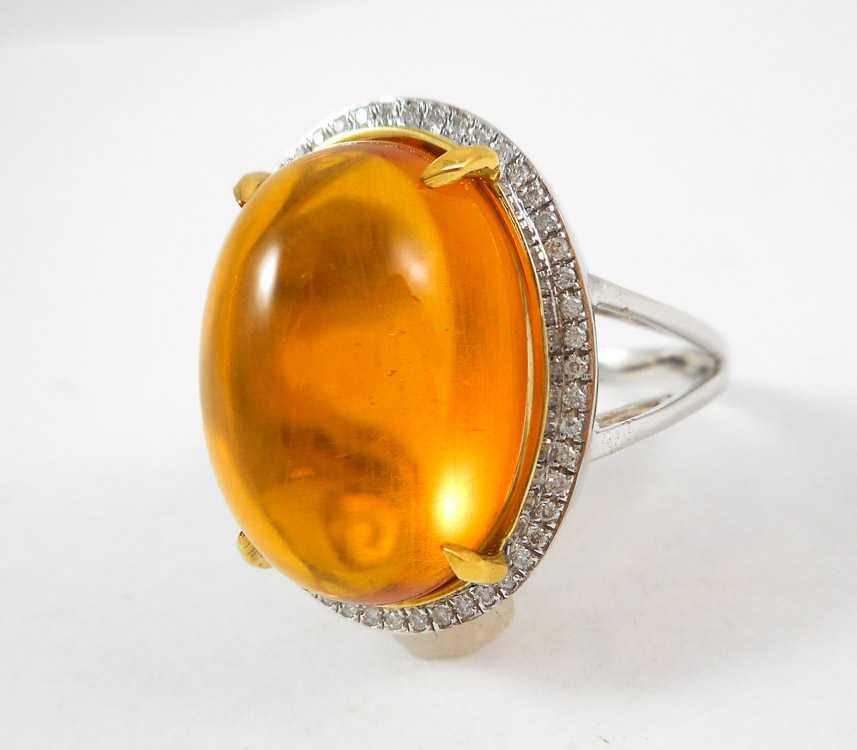 Appraisal: ORANGE CITRINE DIAMOND AND FOURTEEN KARAT GOLD RING with round-cut