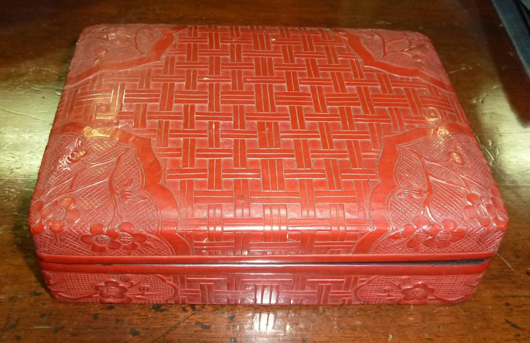 Appraisal: A Chinese cinnabar lacquer box of rectangular form with basketweave