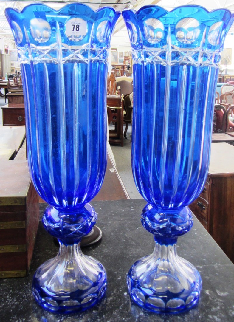 Appraisal: A pair of French clear flash blue overlay glass vases