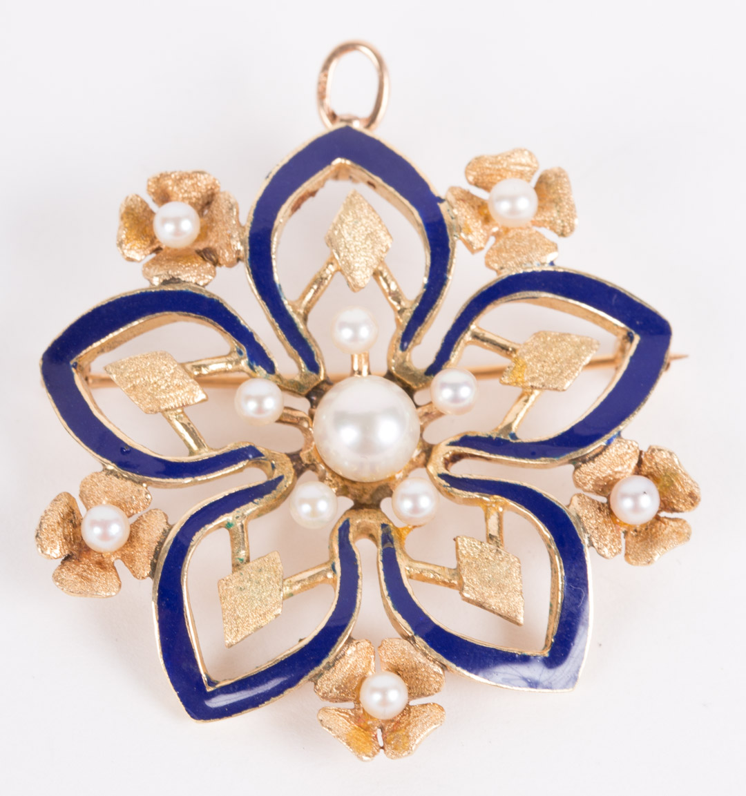 Appraisal: A Pearl and Enamel Brooch K setting featuring a flower