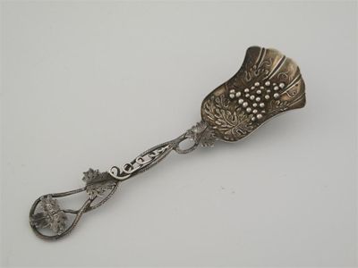 Appraisal: A Victorian caddy spoon with a long openwork leafy tendril