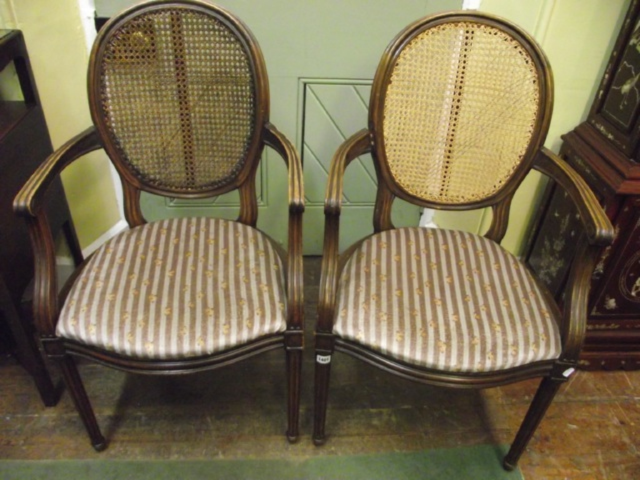 Appraisal: A pair of Hepplewhite style elbow chairs with cameo shaped