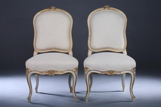 Appraisal: PAIR LOUIS XV STYLE CREAM PAINTED AND PARCEL-GILT SIDE CHAIRS