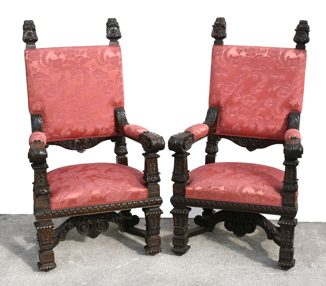 Appraisal: TH C CARVED ITALIAN WALNUT ARMCHAIRS Pair of carved Italian