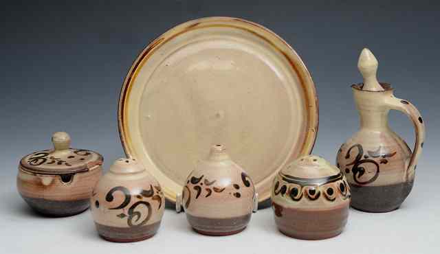 Appraisal: Sidney Tustin British - A Winchcombe Pottery five piece cruet