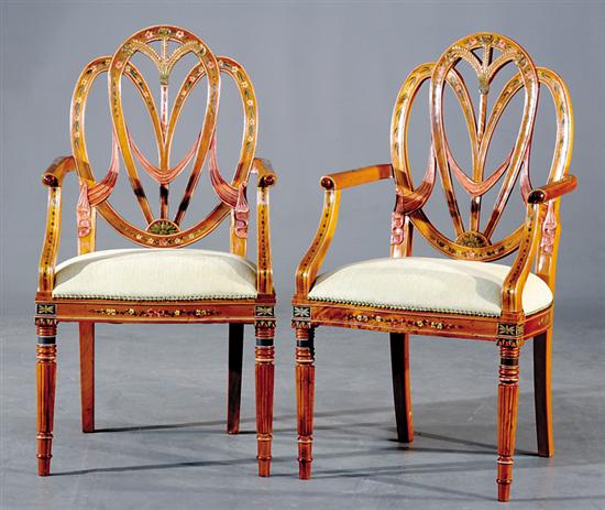 Appraisal: Pair Adam style satinwood armchairs carved and painted shieldback supporting