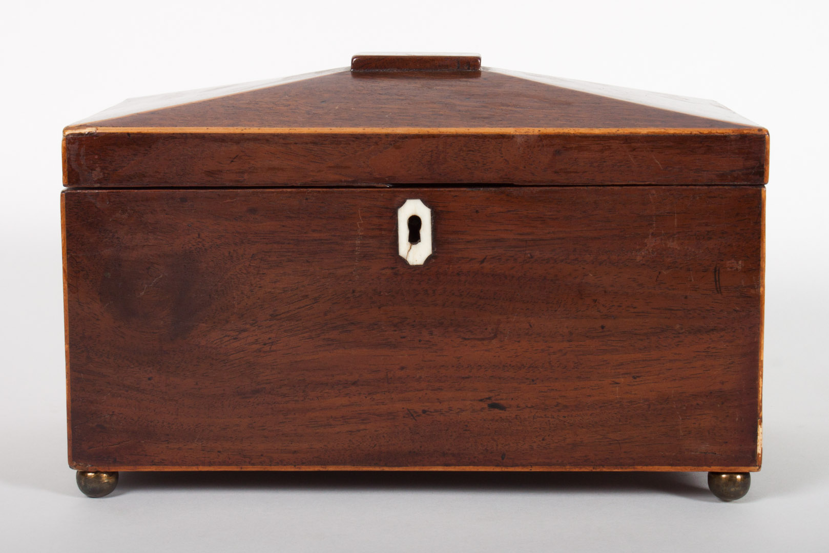 Appraisal: Regency inlaid mahogany tea caddy circa paneled lid ball feet