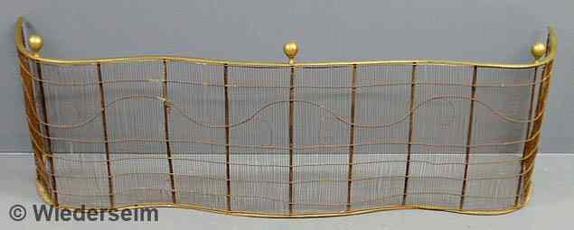 Appraisal: Brass and wire fire screen th c with ball finials