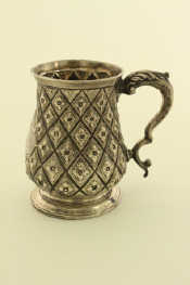 Appraisal: A Victorian silver mug in the historicismus style with leaf