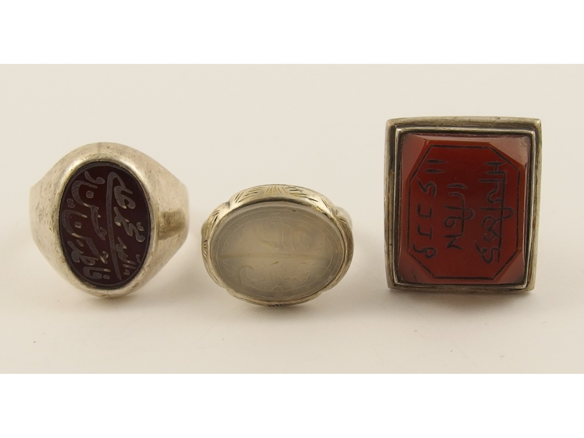 Appraisal: Two Islamic seal ringsboth set with agates and carved with