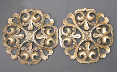 Appraisal: A pair of carved wood roundels pierced design of fleur