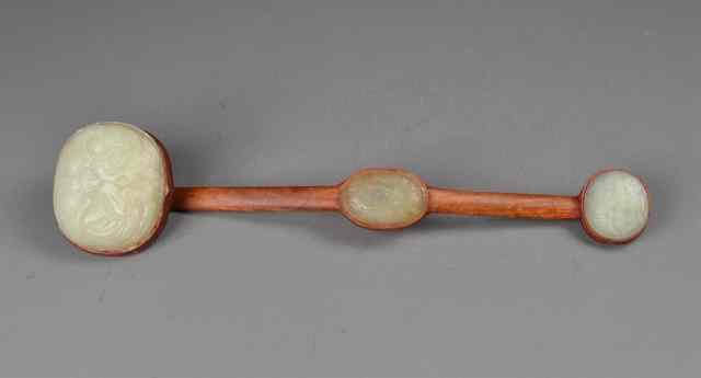 Appraisal: A Chinese Ruyi Scepter with Jade MedallionsFinely carved on the