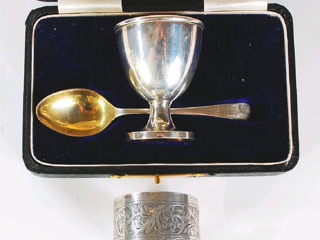 Appraisal: GEORGE V CASED SILVER EGG CUP AND SPOON the cup