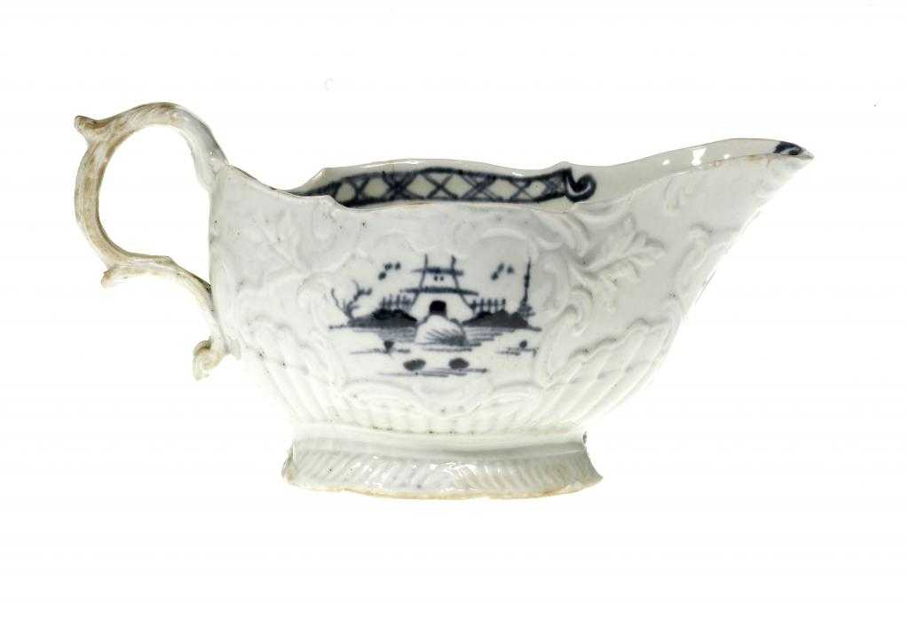 Appraisal: A LIVERPOOL SAUCE BOAT JAMES PENNINGTON moulded with shells leaves