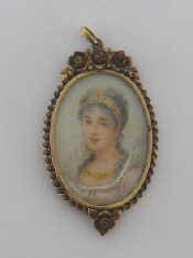 Appraisal: A portrait miniature pendant depicting a lady in three quarter