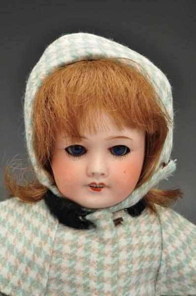 Appraisal: Bleuette Doll with Six Clothing Pieces Description Bisque head doll