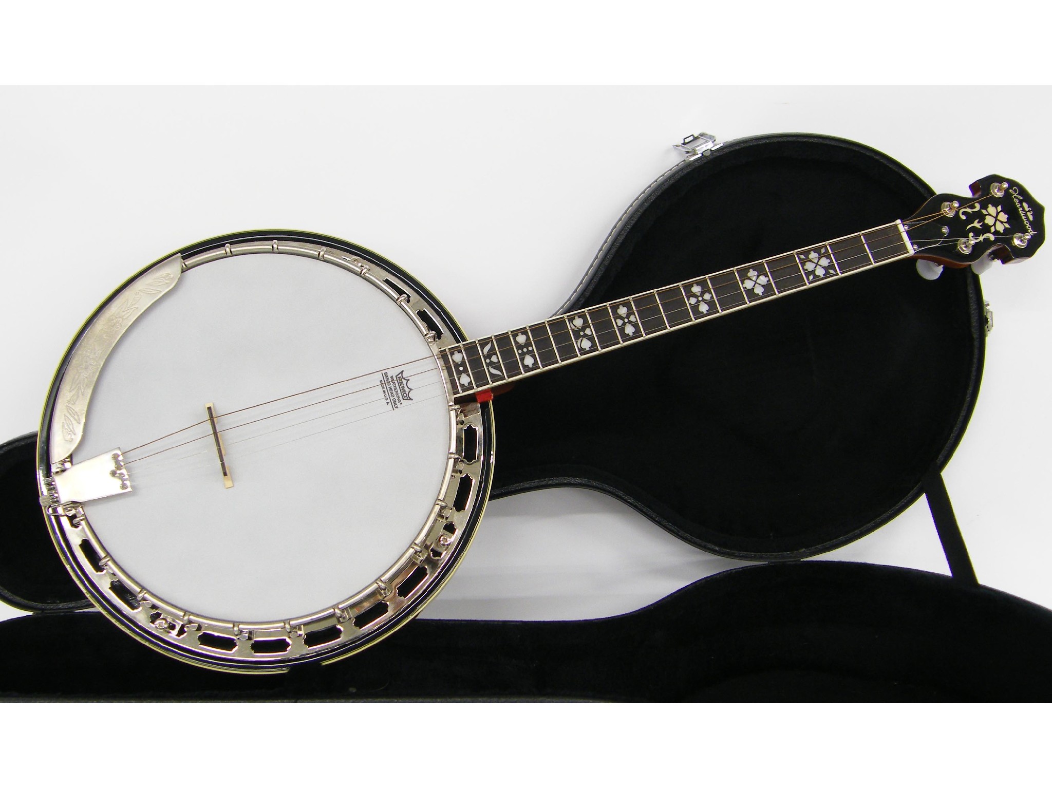 Appraisal: Heartwood tenor banjo with skin and scale hard case