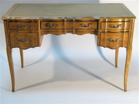 Appraisal: SLIGH-LOWRY FRENCH PROVENCIAL STYLE DESK The leather inset shaped rectangular