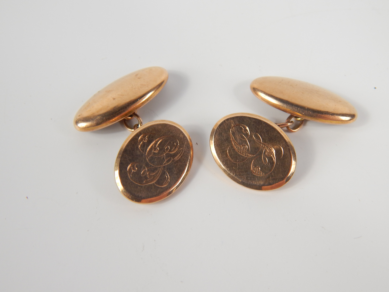 Appraisal: A pair of ct gold oval cufflinks with engraved initial