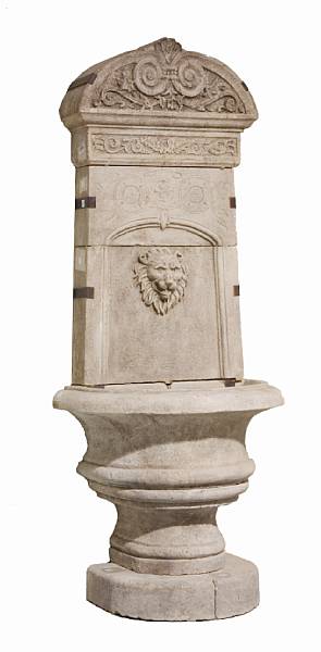 Appraisal: An Italian Baroque style vicenza stone wall fountain The arched