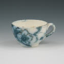 Appraisal: Flow Blue tea cup with gilded accents and applied handled