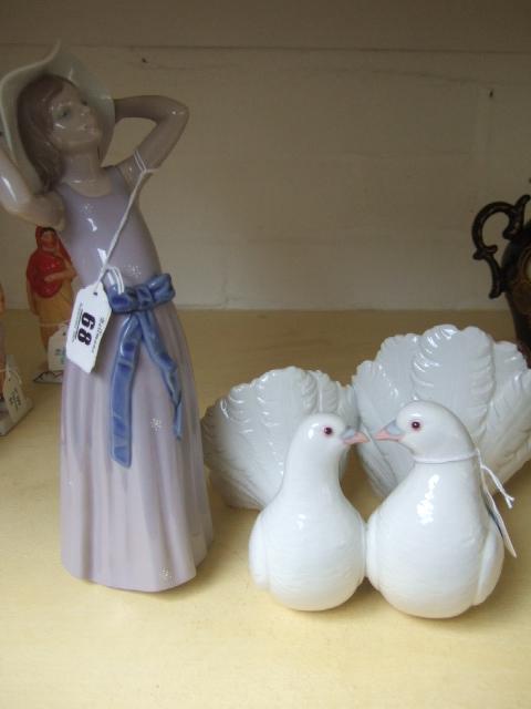 Appraisal: Two Lladro figures two doves and a young girl in