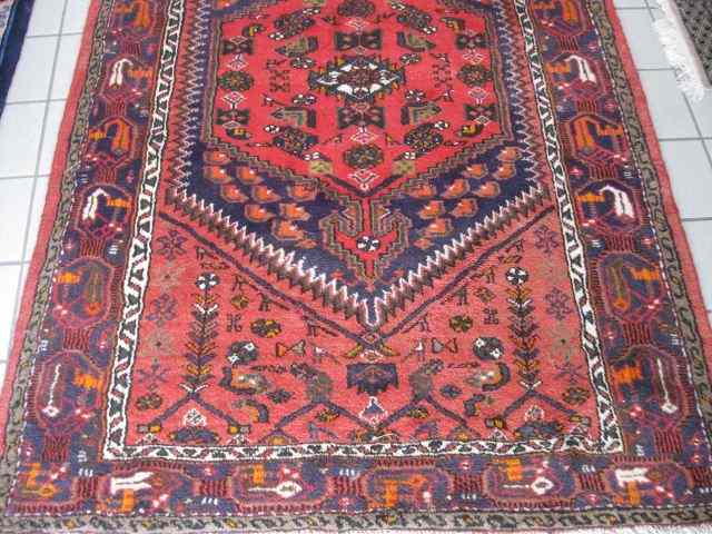 Appraisal: Hamadan Persian Handmade Rug geometric designs stylized florals on salmon