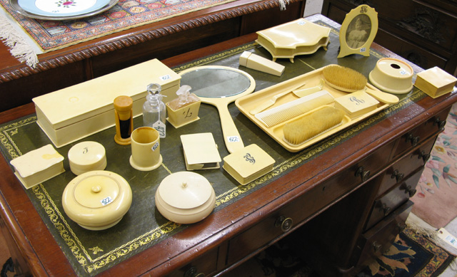 Appraisal: TWENTY-THREE PIECE PYROLIN IVORY DRESSER SET Including a hand mirror