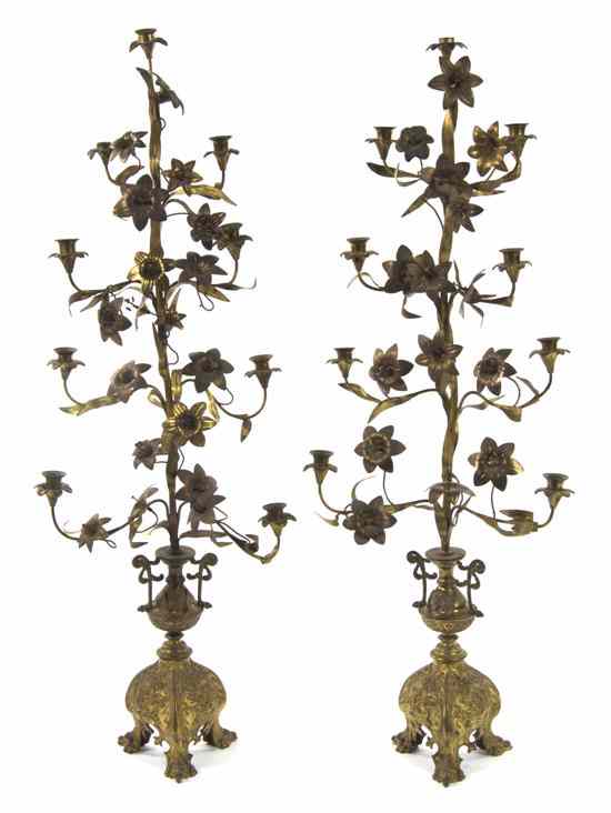 Appraisal: A Pair of Continental Gilt Metal Nine-Light Candelabra each having