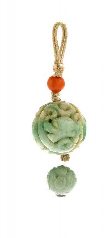 Appraisal: TWO CHINESE CARVED JADEITE NECKLACE BEADS the larger worked with