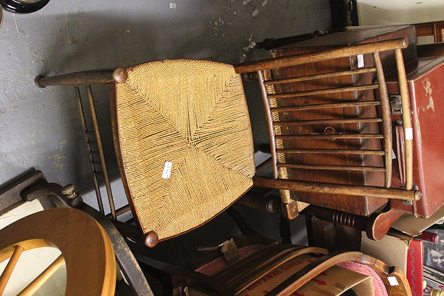 Appraisal: AN OLD ASH AND ELM WINDSOR STICK BACK ARMCHAIR together