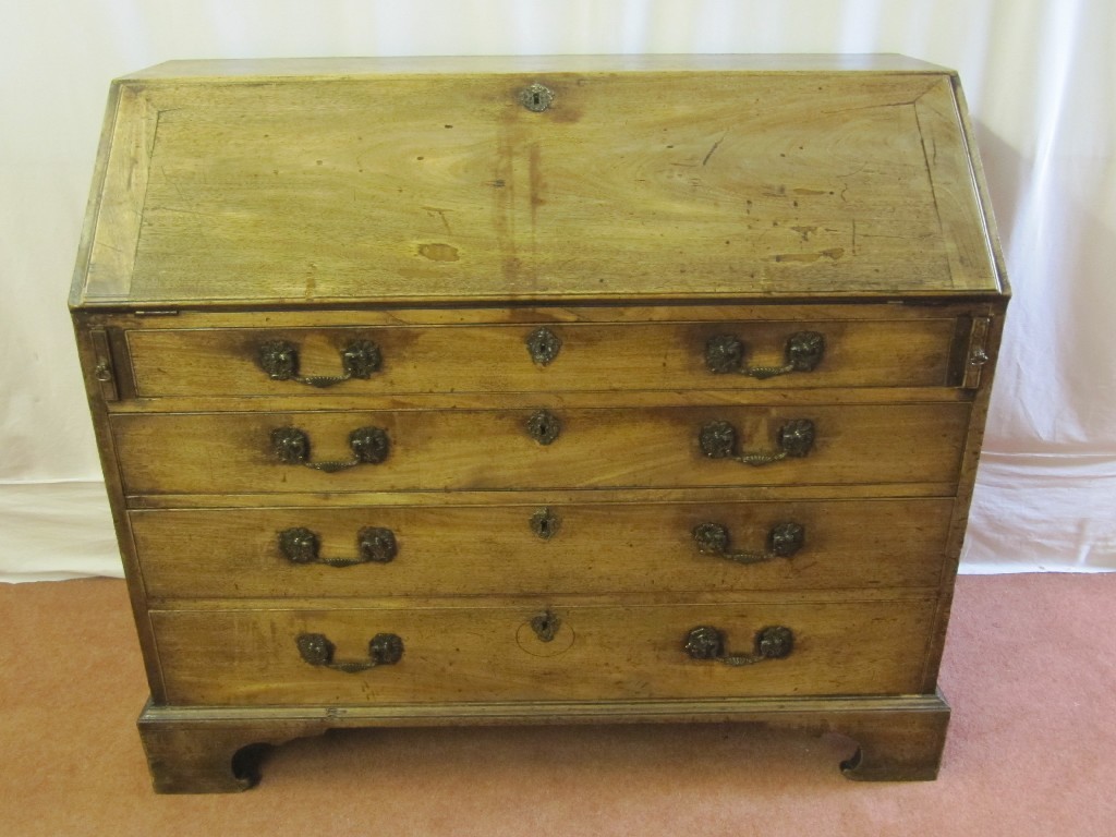 Appraisal: A th Century oak writing bureau the drop flap revealing