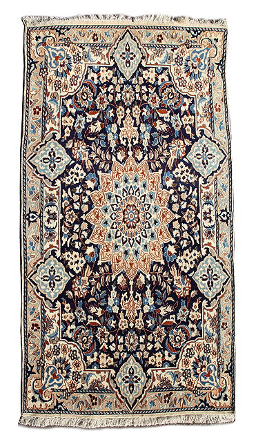 Appraisal: A PERSIAN BLUE GROUND RUG with a central formal star