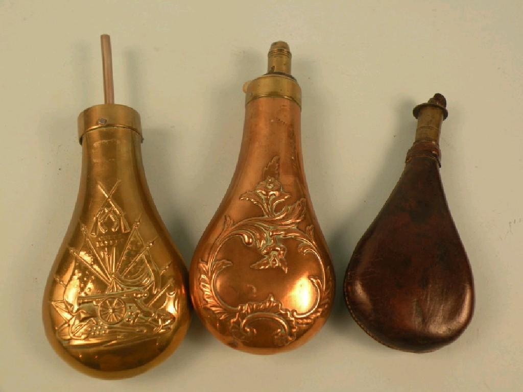 Appraisal: An early thC copper and brass powder flask decorated with