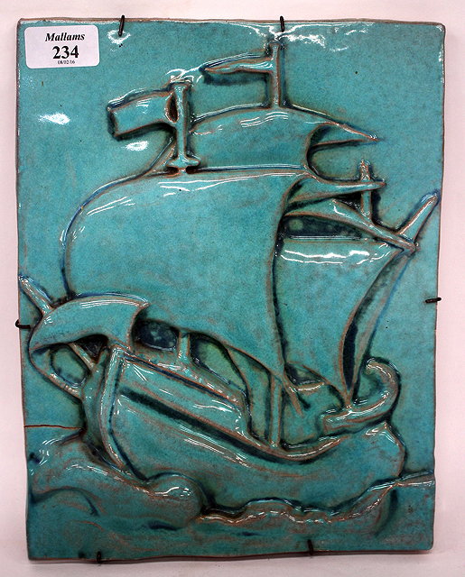 Appraisal: A TH CENTURY POTTERY TILE decorated in turquoise glazes and