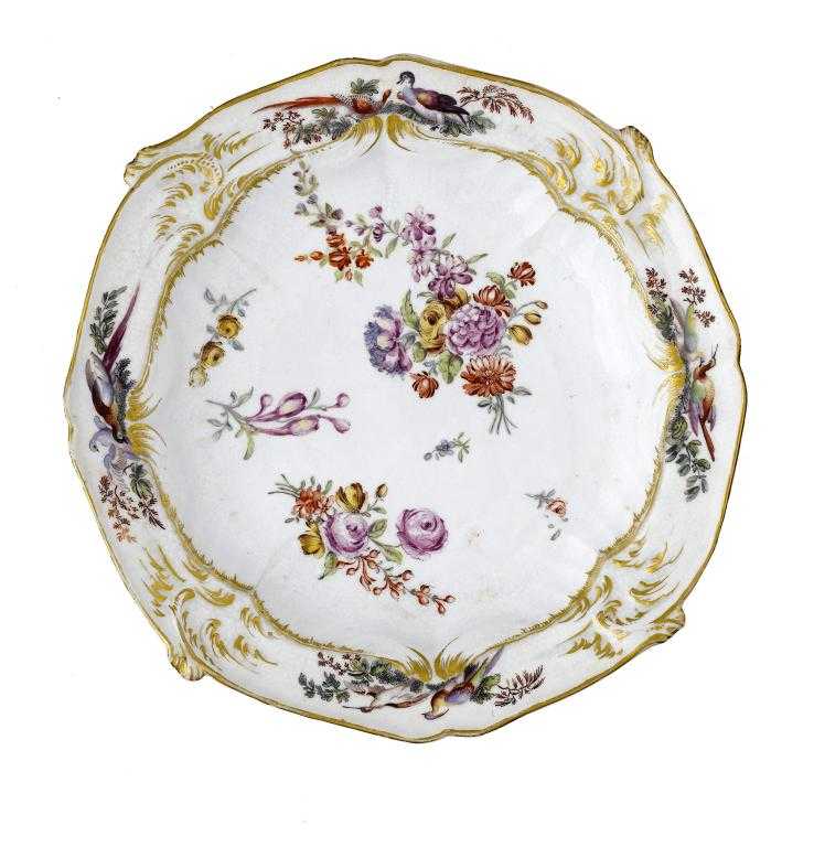 Appraisal: A CHELSEA PLATE enamelled with two sprays and scattered flowers