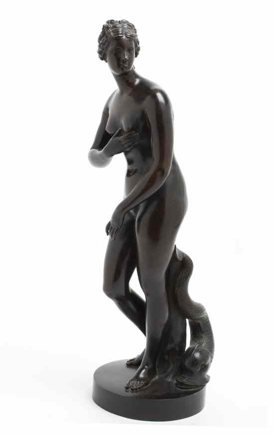 Appraisal: A Continental Bronze Figure depicting a nude female figure flanked