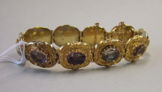 Appraisal: An early th century gold and foil backed vary coloured