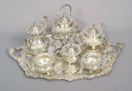 Appraisal: PIECE REPOUSSE SILVERPLATE TEA SERVICE To include Hot water kettle